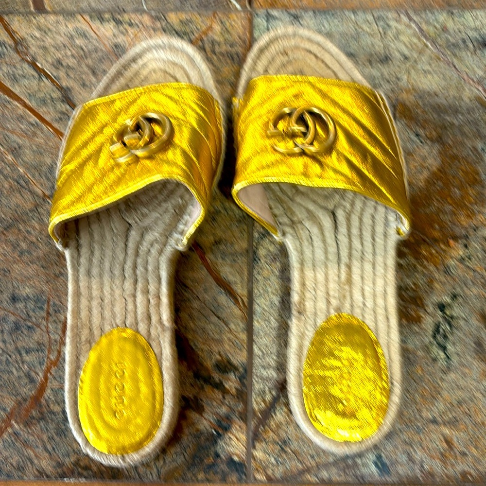 Gold Gucci espadrilles.